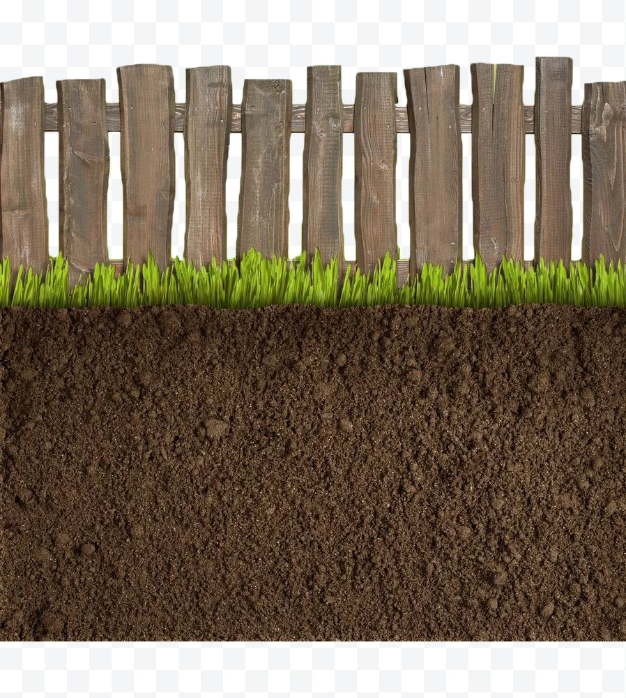 Wooden fence with grass and soil