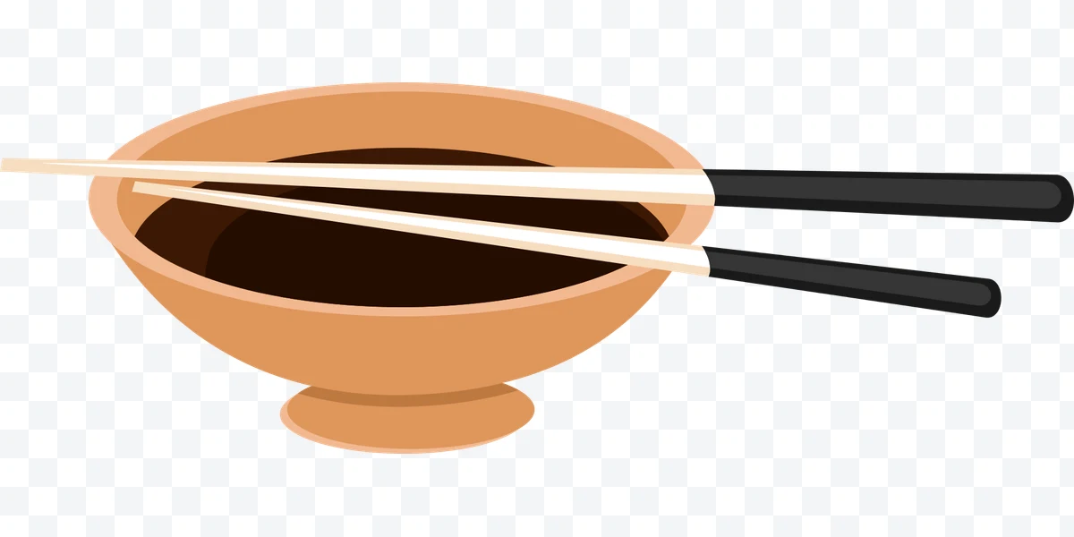 Bowl with sauce and chopsticks