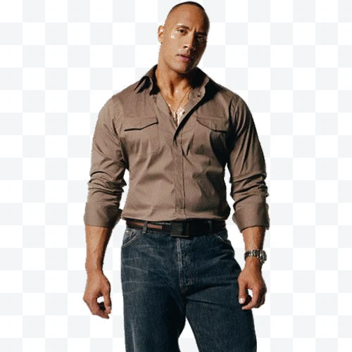 Dwayne Johnson in brown shirt and blue jeans standing and posing