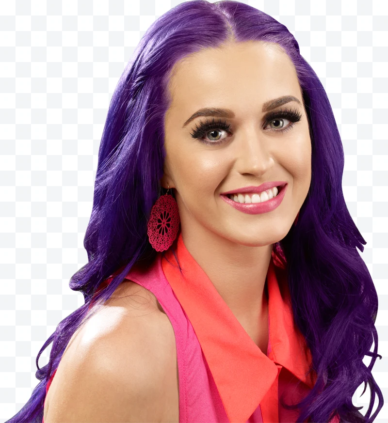 Katy Perry with purple hair, red earrings, and pink and red top smiling.