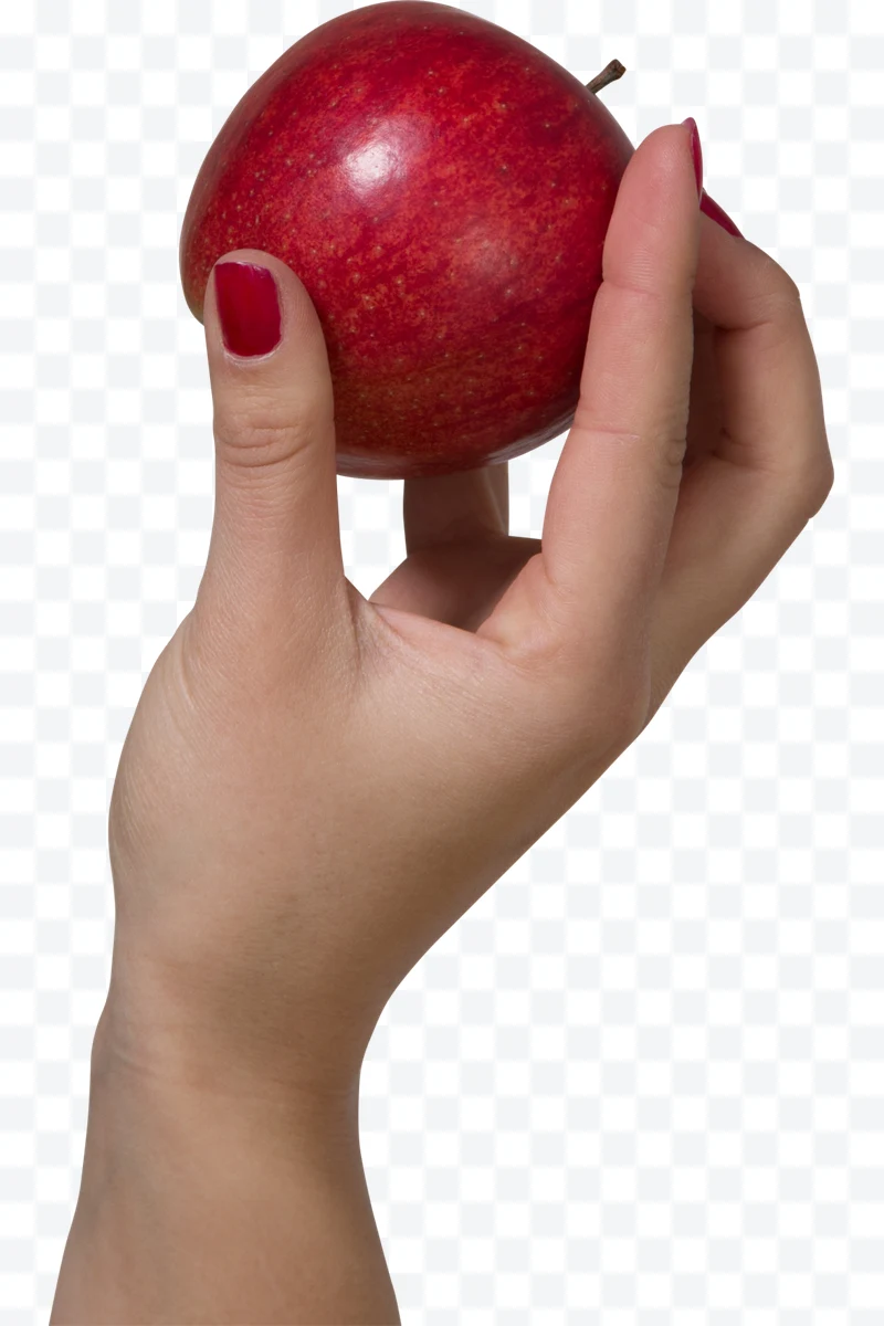 Hand with red nails holding a red apple.
