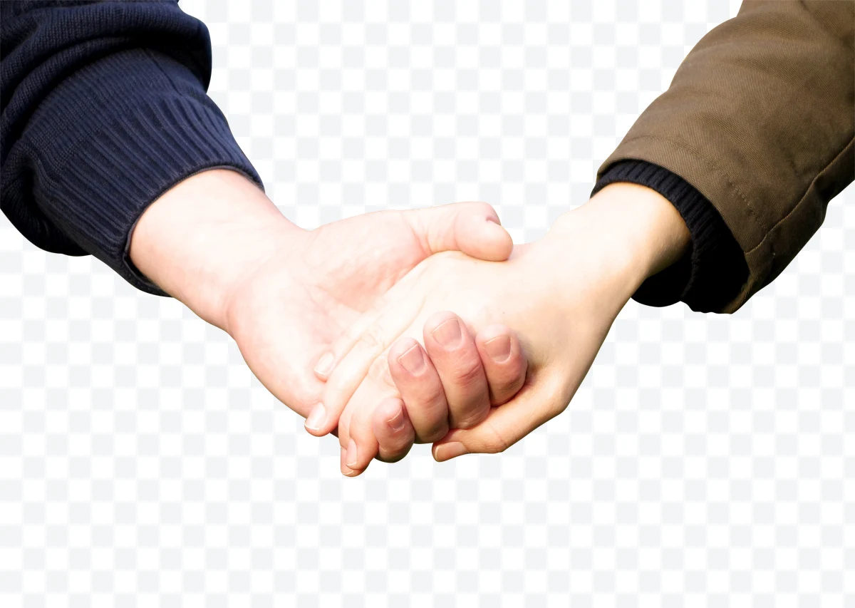 Intertwined hands of two people with blue sweater and brown jacket sleeves