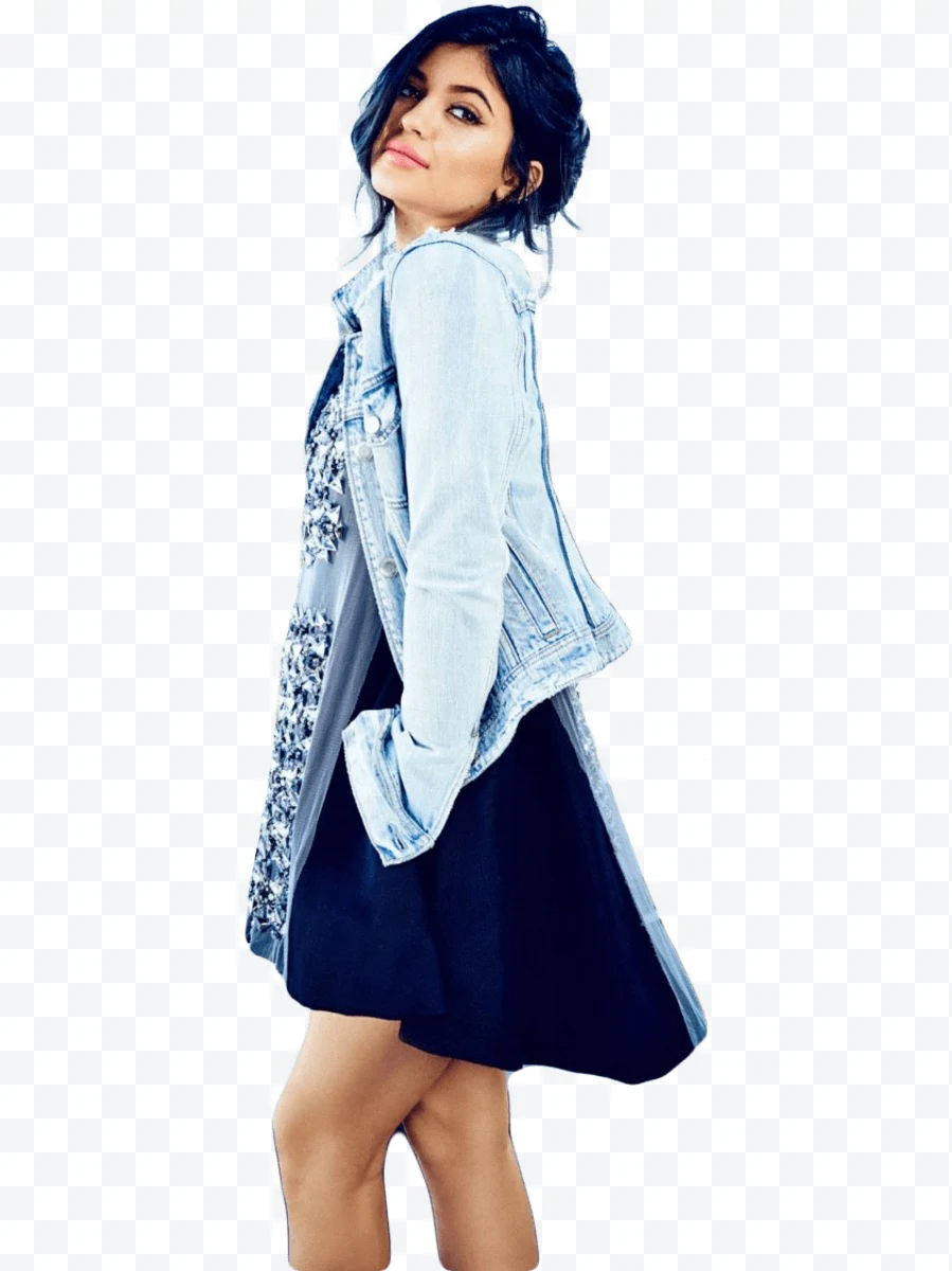 Young woman with light denim jacket and black dress posing in profile