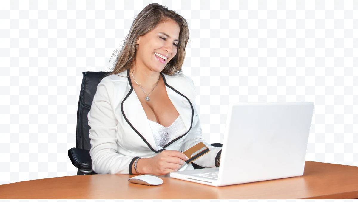 Woman in white blazer with gold credit card using laptop
