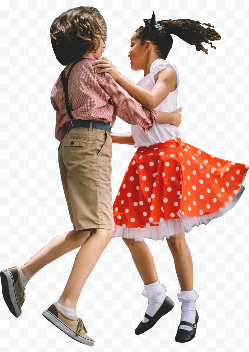 Children dancing, girl with red polka dot skirt and boy in shorts
