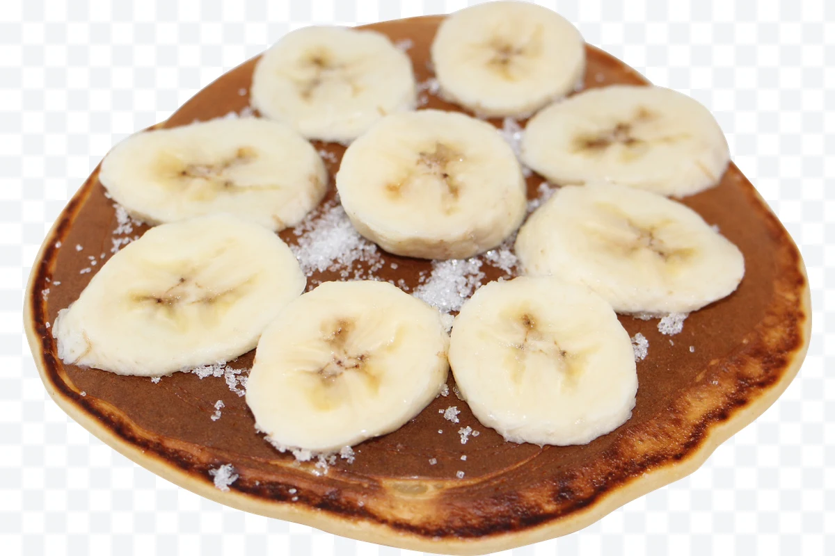 Pancake with banana slices and sprinkled sugar