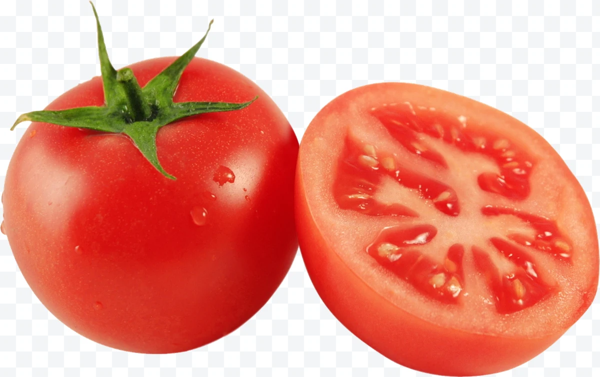 Whole red tomato and halved tomato with visible seeds