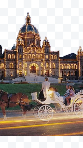 Edificio del Parlamento de Columbia Británica iluminado con carruaje de caballos
