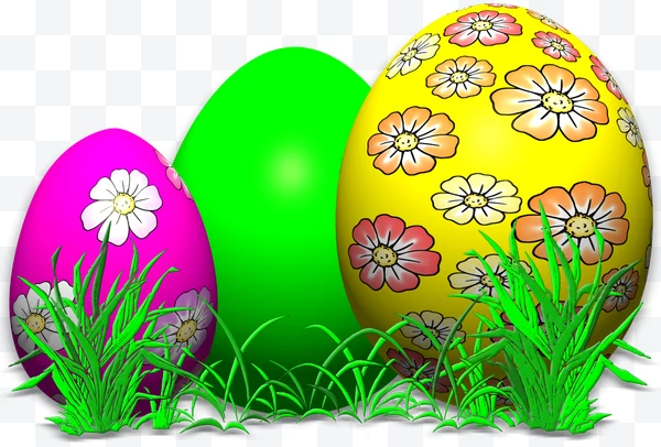Huevos de Pascua decorados con flores sobre hierba verde