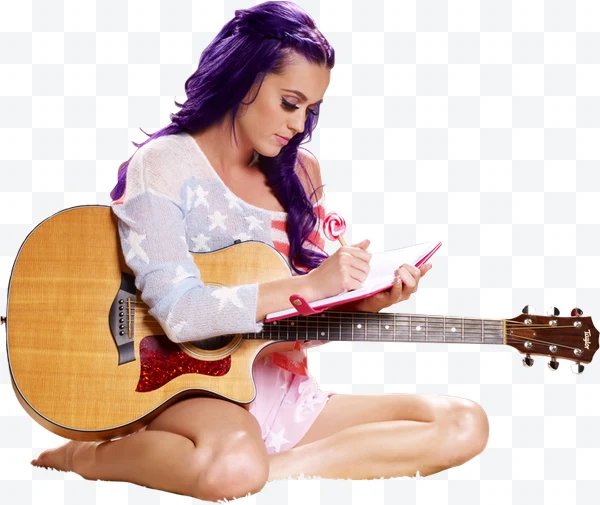 Katy Perry con cabello morado sentada escribiendo en un cuaderno con guitarra
