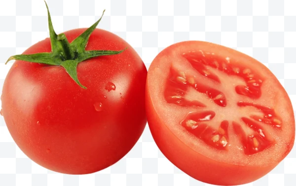 Tomate rojo entero y tomate cortado por la mitad con semillas visibles